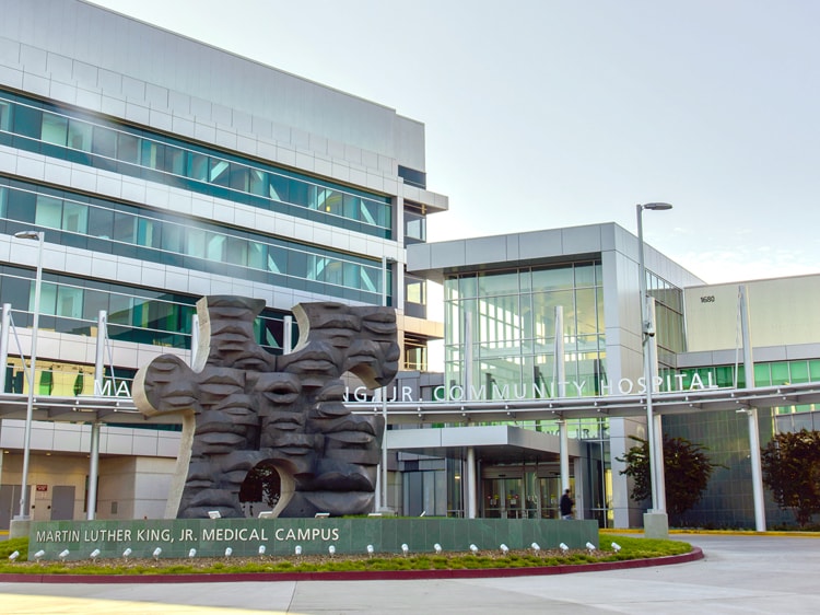 Entrance to the hospital behind the puzzle sculpture and circle drive