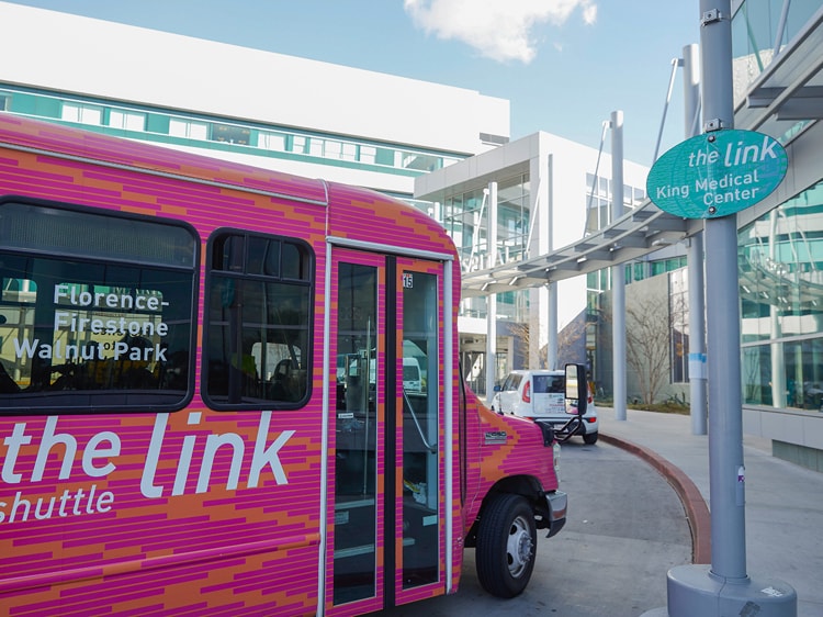 Pink shuttle bus