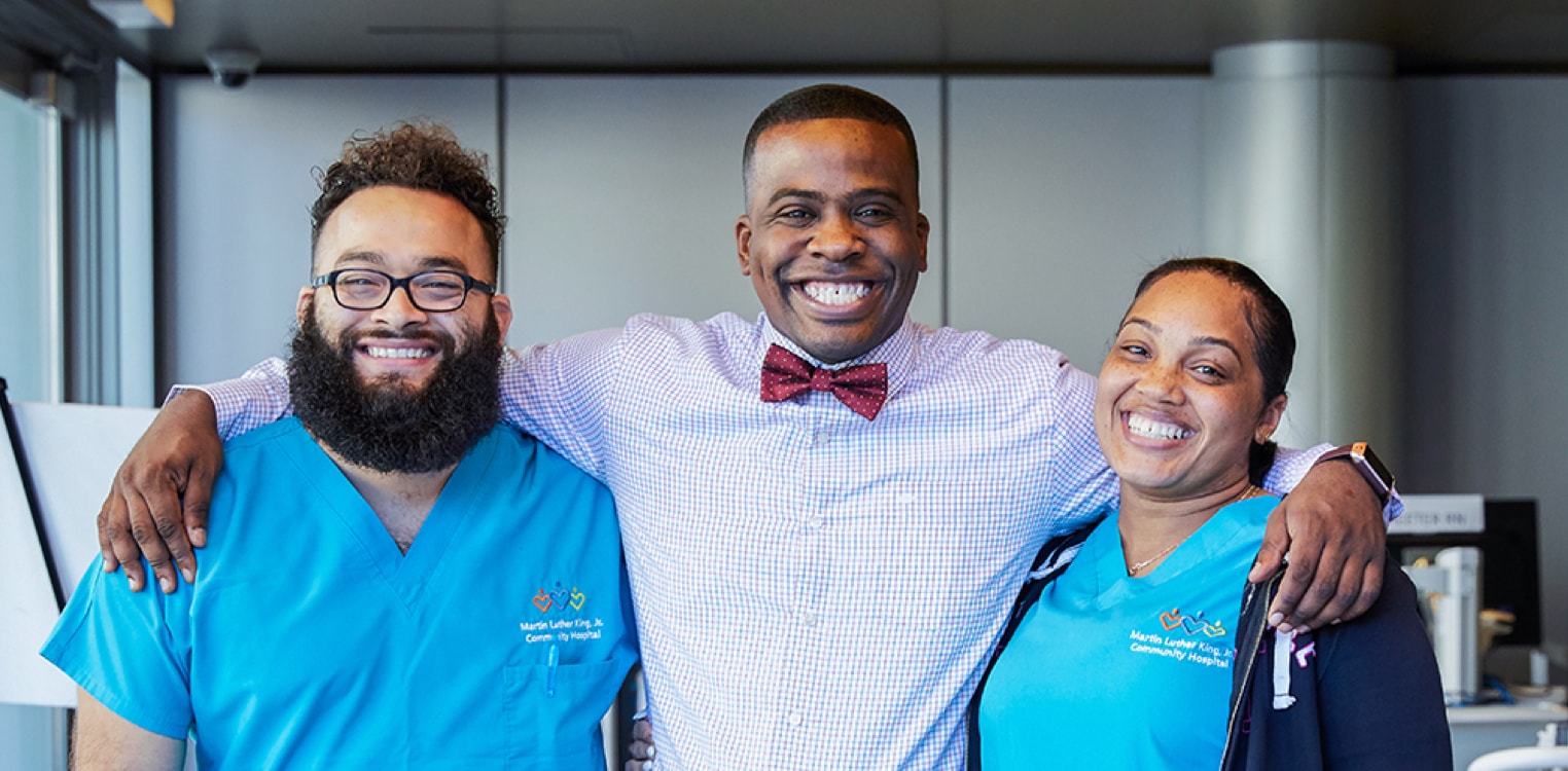 Two African American hospital nurses and a hospital visitor