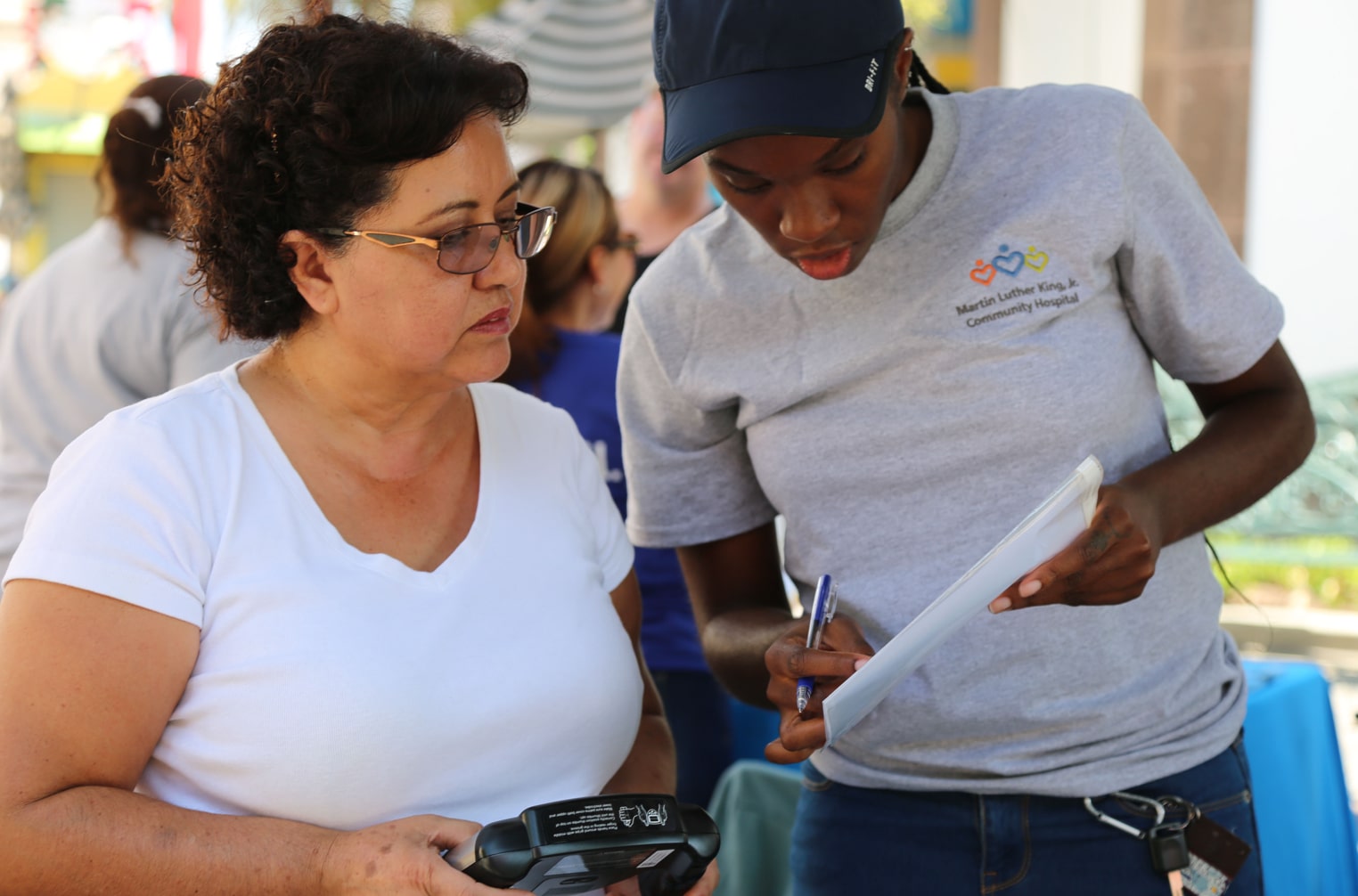 Two women looking at a flyer