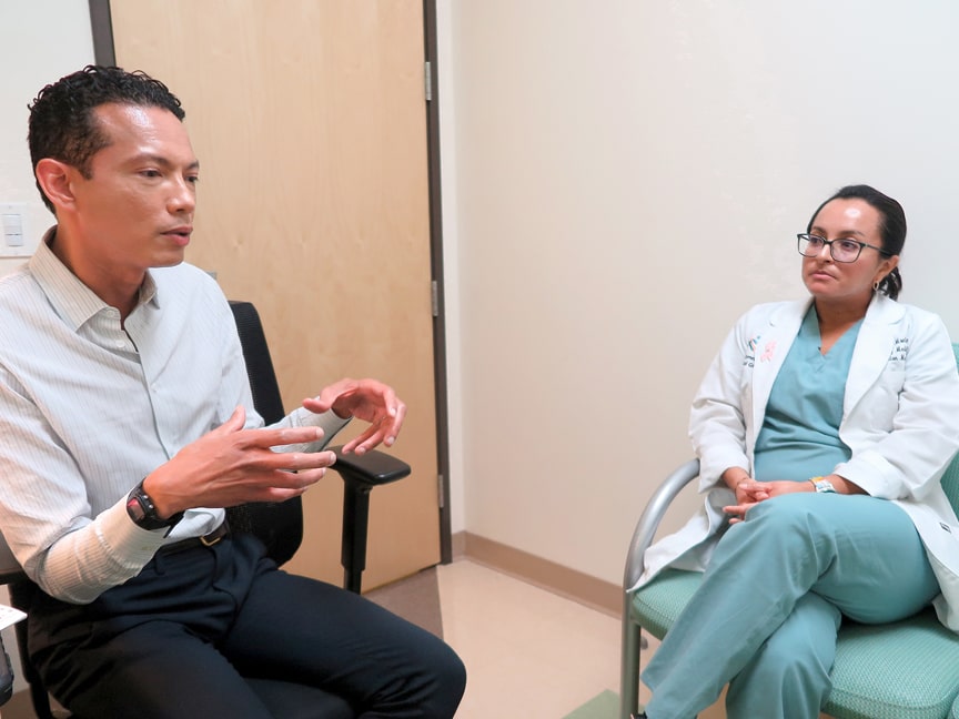 Dr. Yulsi Fernandez Montero and Dr. PK Fonsworth talking