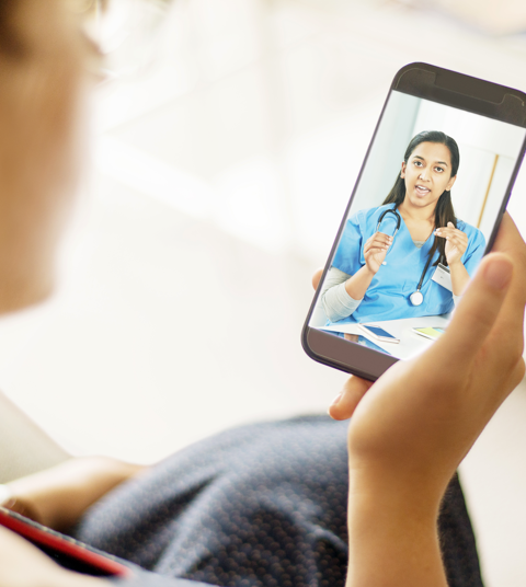 Close up of a nurse on screen of mobile phone