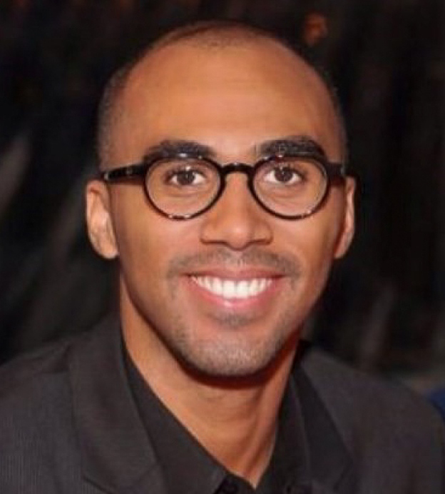 Portrait of Todd Hawkins, a young Black man wearing glasses