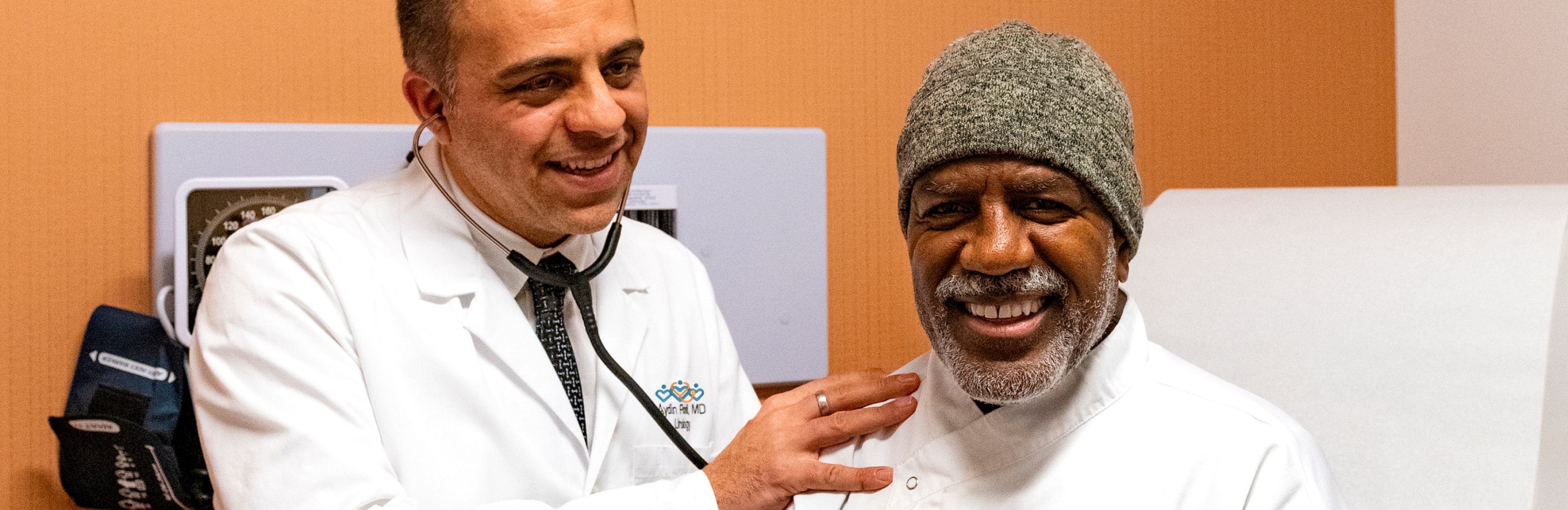 Male physician with a male, African American patient