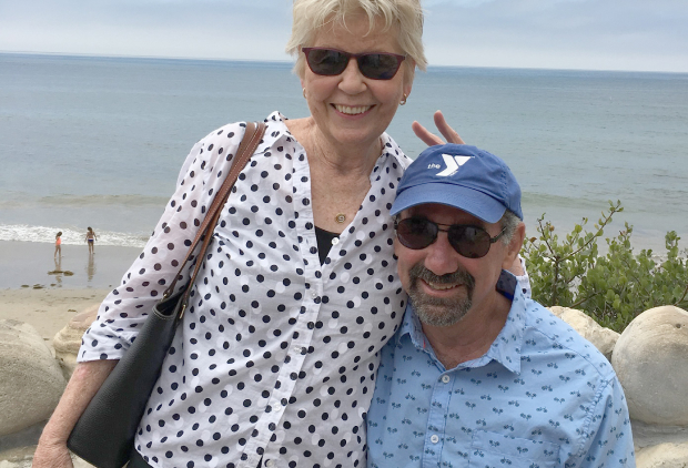 Jane and Larry Rosen standing on a beach