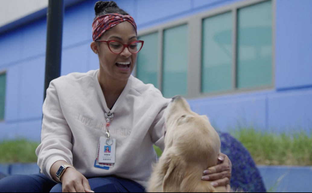 The Dream Show 2026 Taking Woman petting a dog