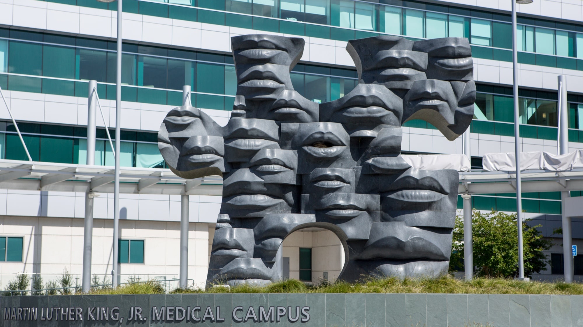 Puzzle piece sculpture in front of MLKCH hospital entrance