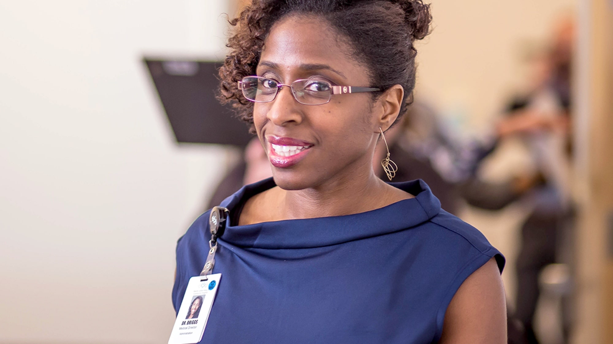 Smiling portrait of young black female doctor