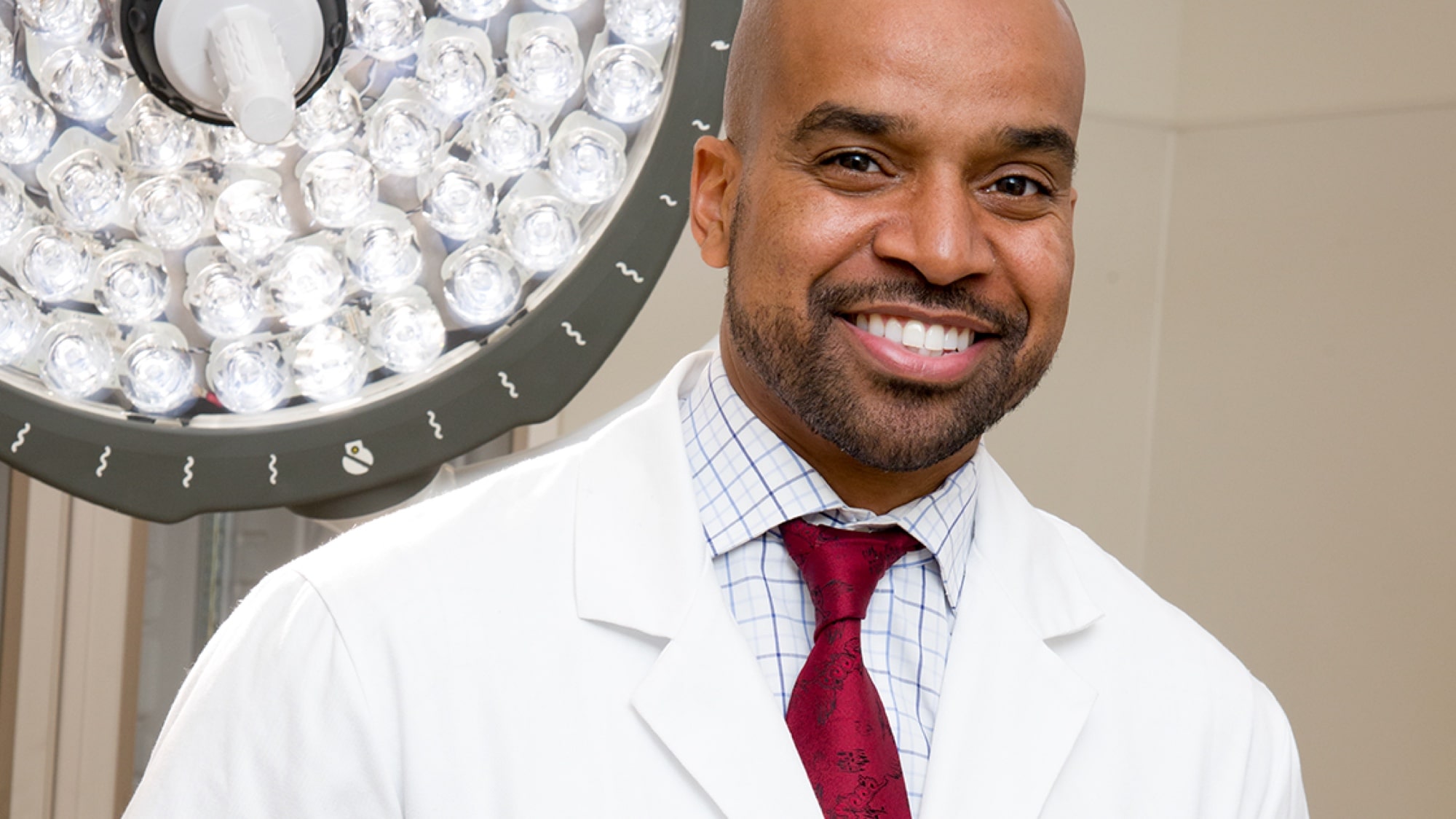 Smiling portrait of young black male doctor