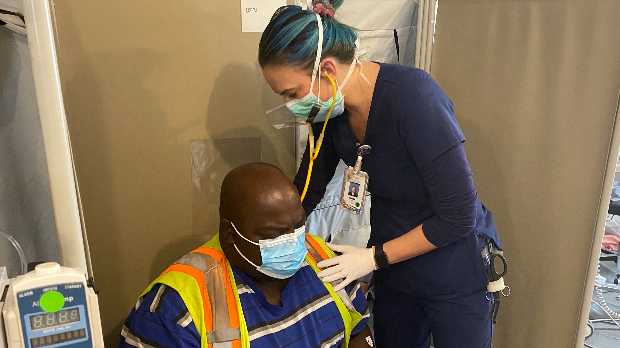 Nurse Danica Riedlinger treats a patient