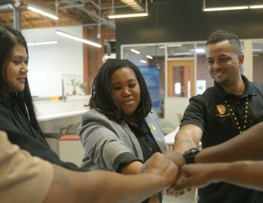 Team putting hands together