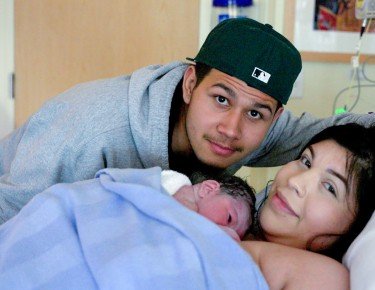 Mom and dad with their newborn baby
