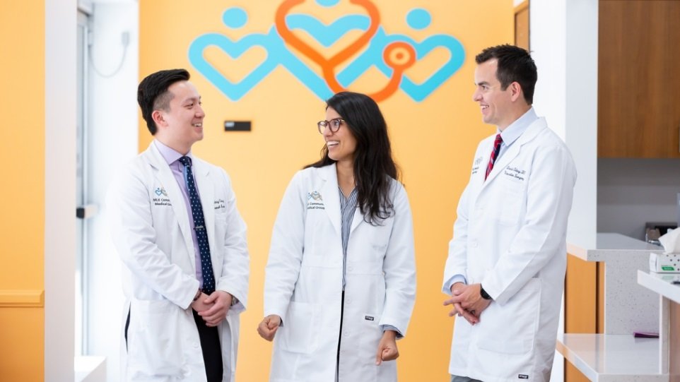 Photo of two male doctors and one female doctor