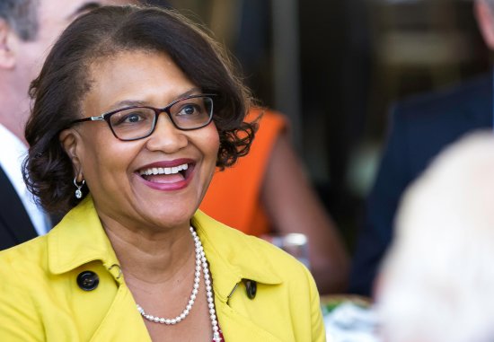 Close up of Dr. Elaine Batchlor, a middle-aged Black woman, smiling at an event
