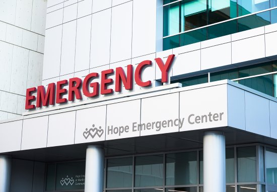 Close up of red emergency sign on emergency room exterior