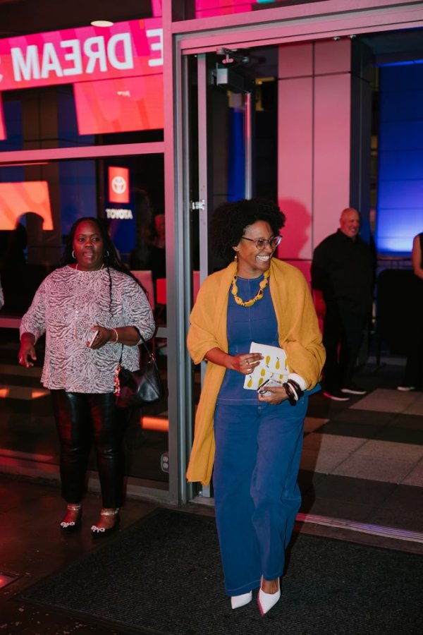 woman walking into building