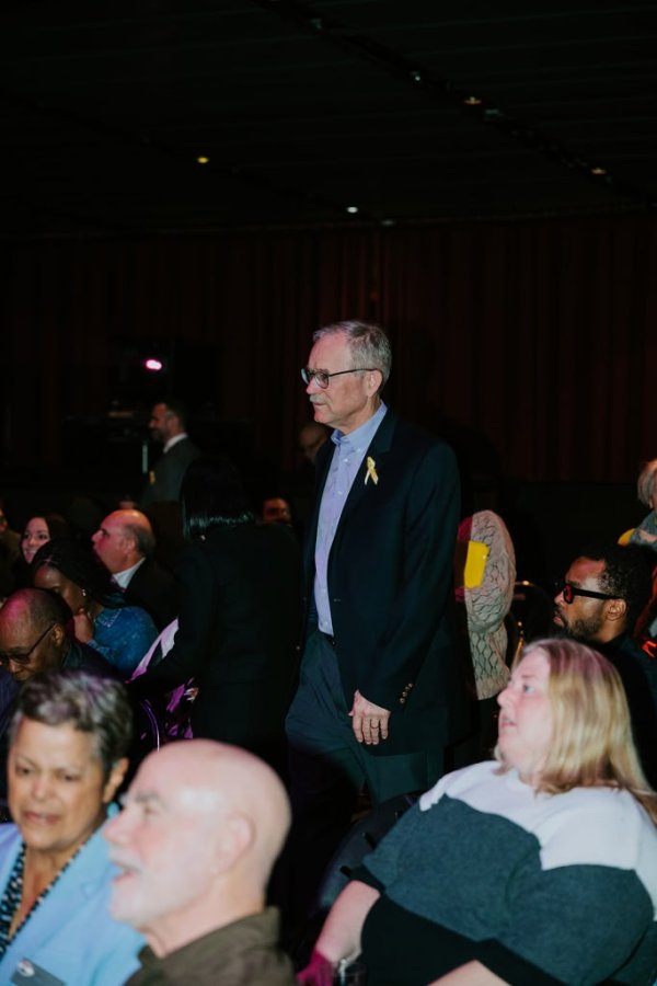 man standing in a threatre