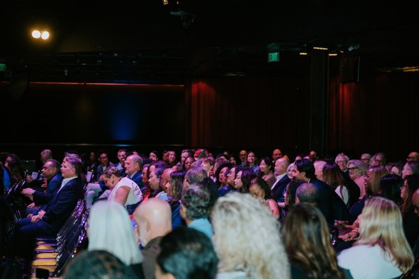 people sitting in a theatre