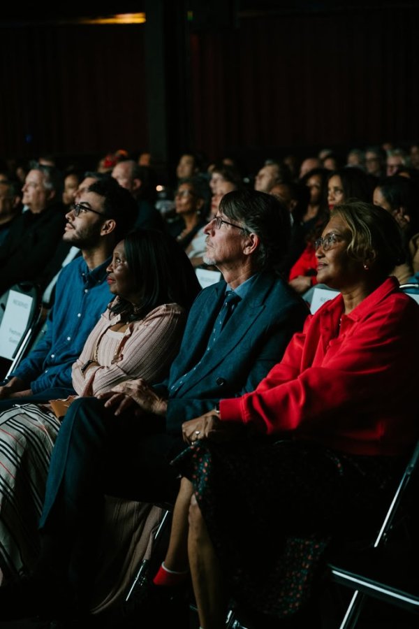 people watching a screen