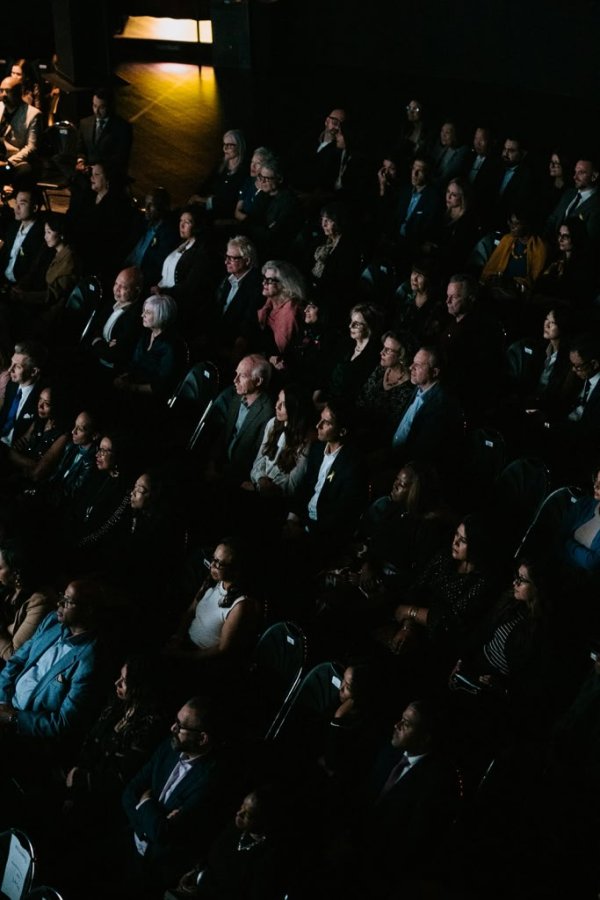people sitting in a theatre