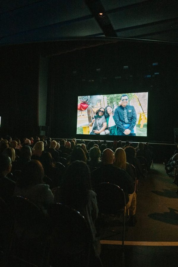 people watching a film in a theatre