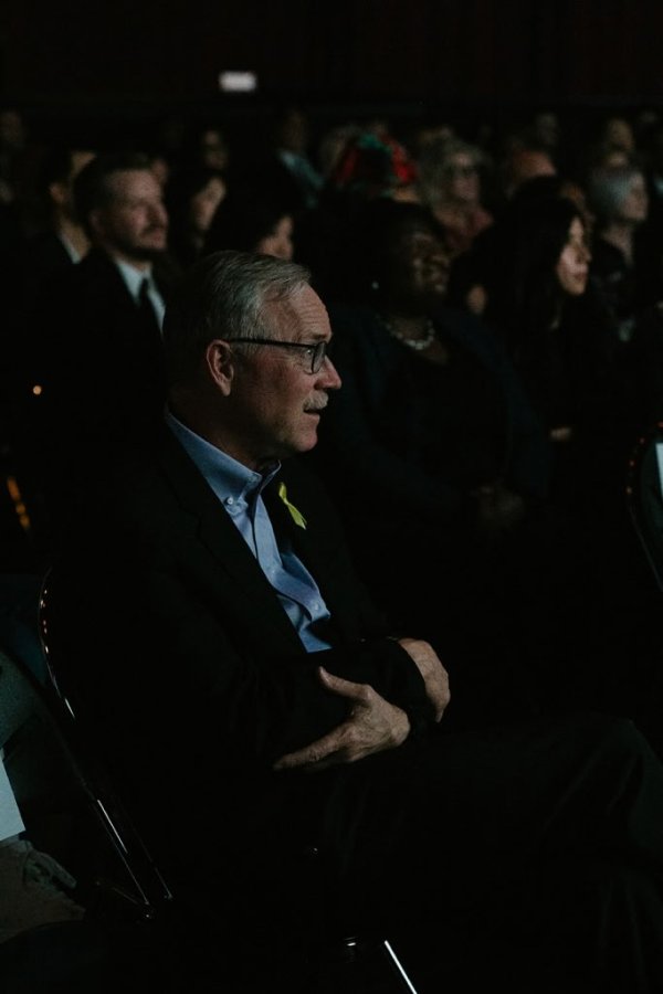 man smiling at screen