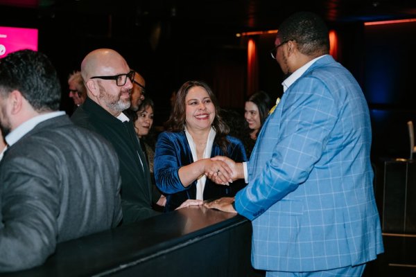 man and woman greeting someone