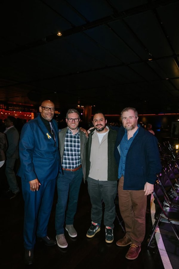 group of men taking photo together