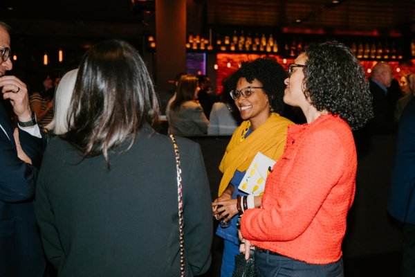 woman smiling at group of women