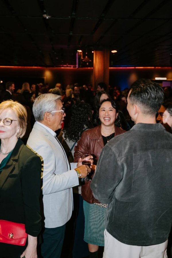 group of people smiling and talking