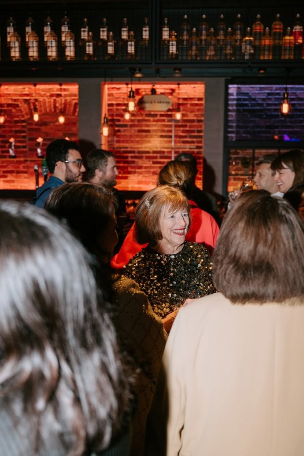 woman smiling and talking