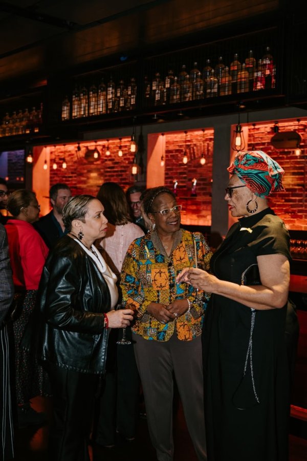 group of women smiling and talking