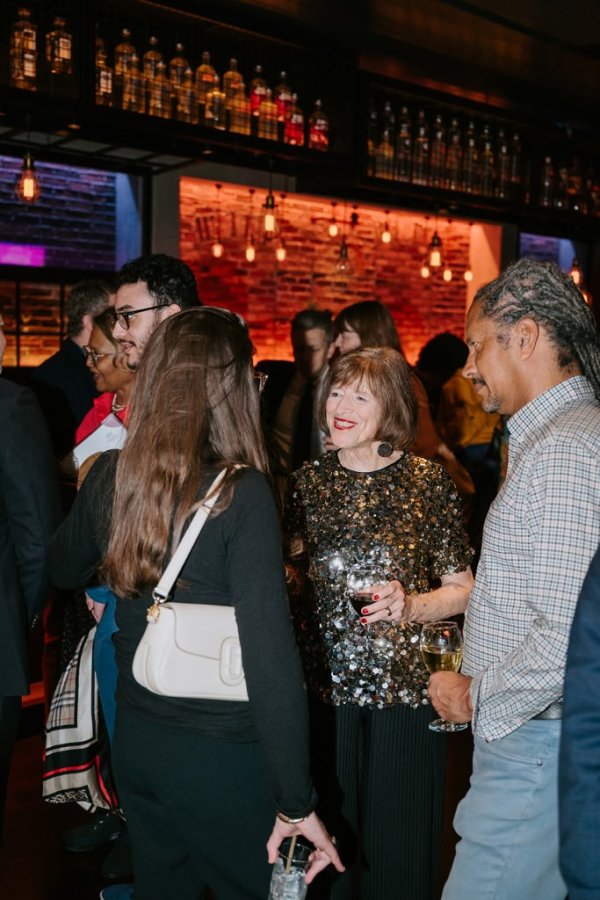 group of people smiling and talking