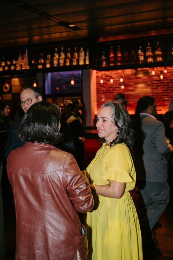 woman smiling and talking to woman
