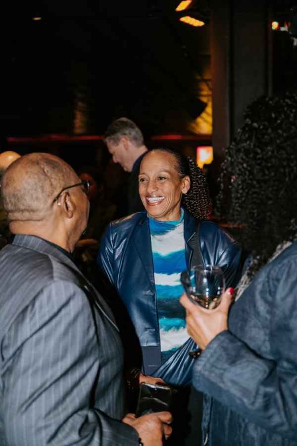 group of people smiling and talking