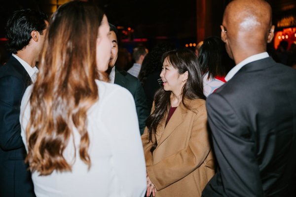 group of people smiling and talking