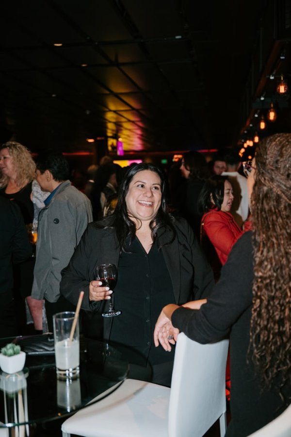 group of women smiling and talking