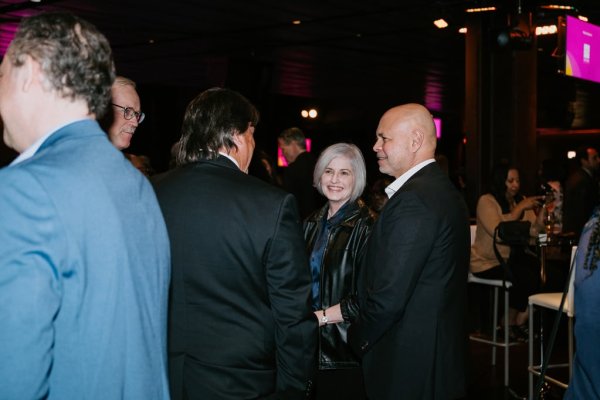 group of people smiling and talking