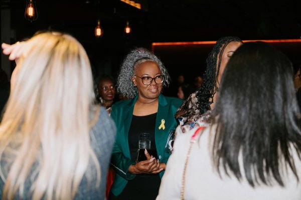 group of women smiling and talking