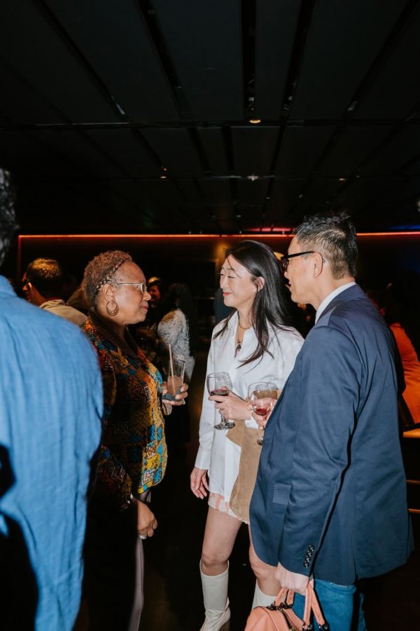 group of people smiling and talking