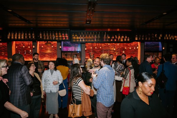 group of people smiling and talking