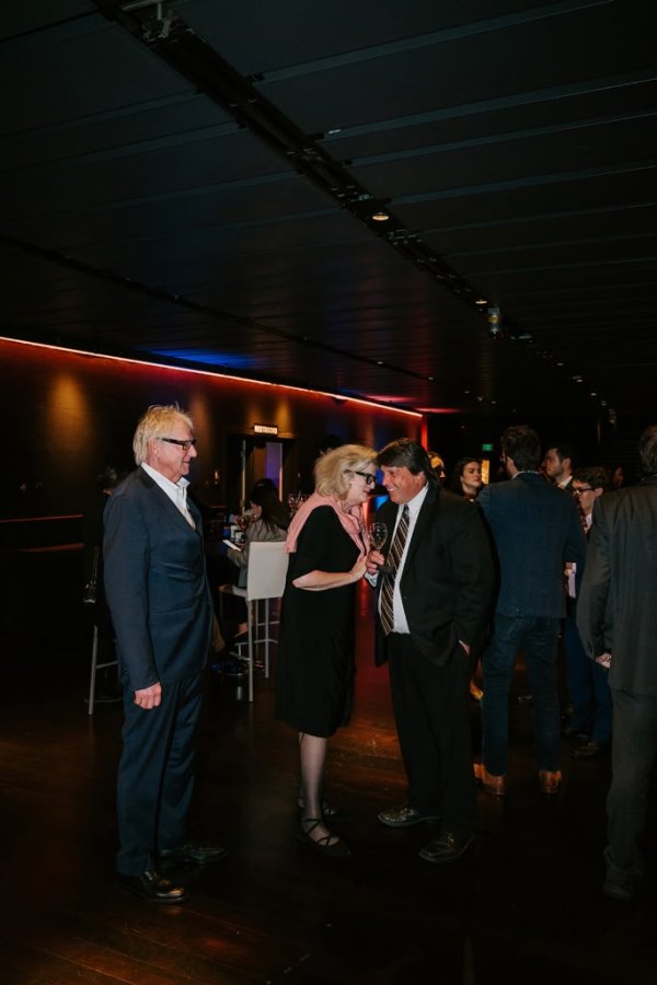 group of people smiling and talking