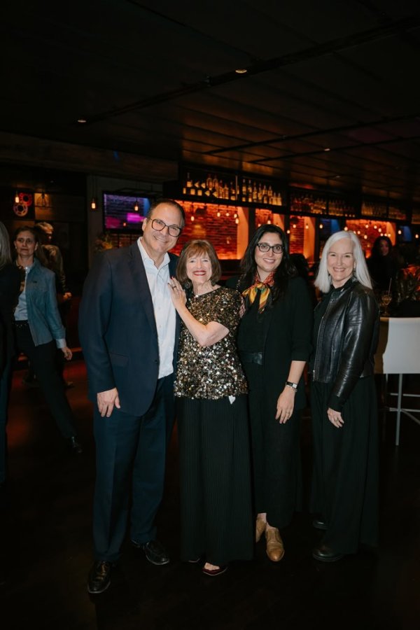 group of people smiling for a photo