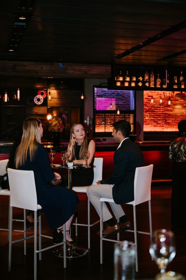 3 people sitting at a table