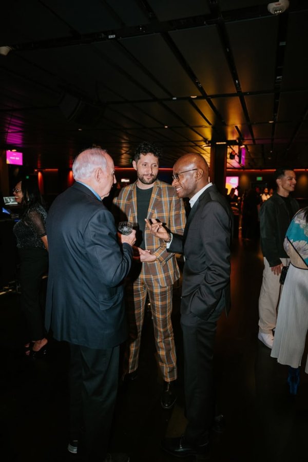 group of people smiling and talking