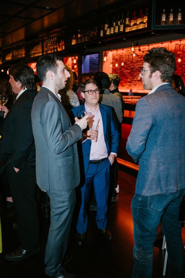 group of men smiling and talking