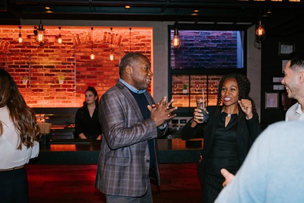 group of people smiling and talking