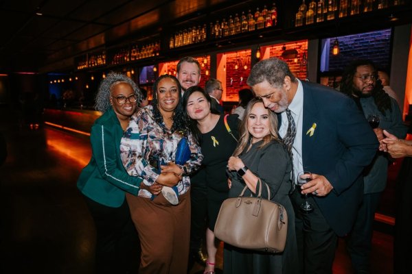 group of people smiling for a photo