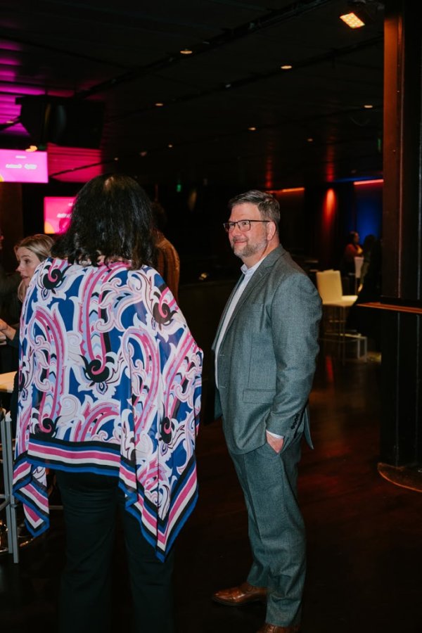 man speaking with a woman