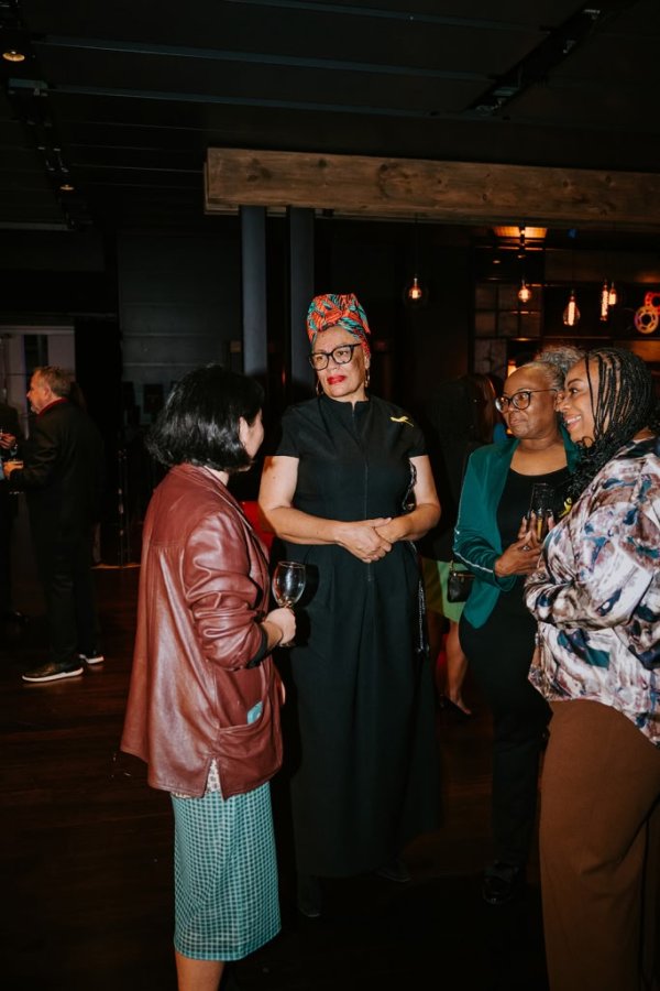 group of women smiling and talking